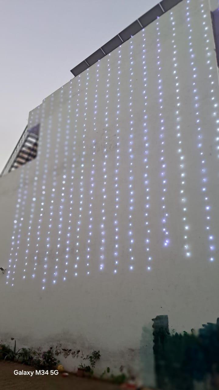 LED curtain lights installed across a boundary wall in Mohali