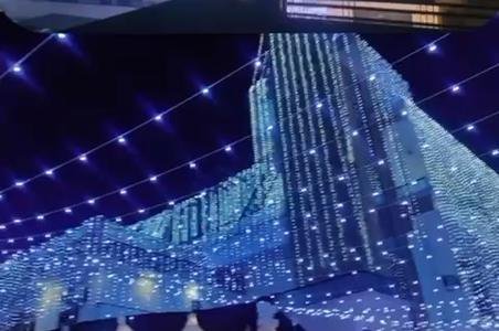 Large venue lit with blue and white decorative lighting