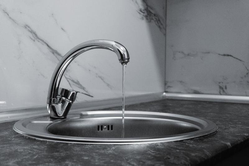 Clean filtered water running from a kitchen tap